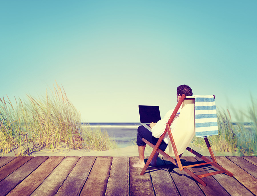 Businessman working by the beach