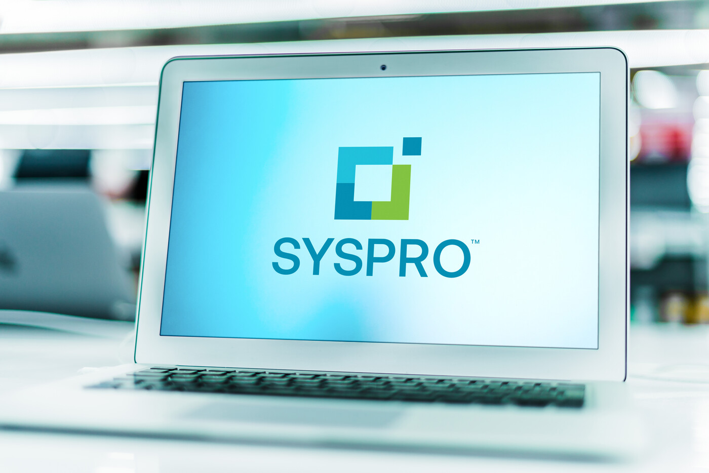 laptop computer displaying logo of syspro